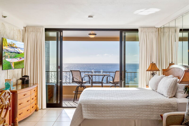 Maui Kai 806 fully equipped kitchen with Hawaiian-style earth tone colors and ocean view preparation island